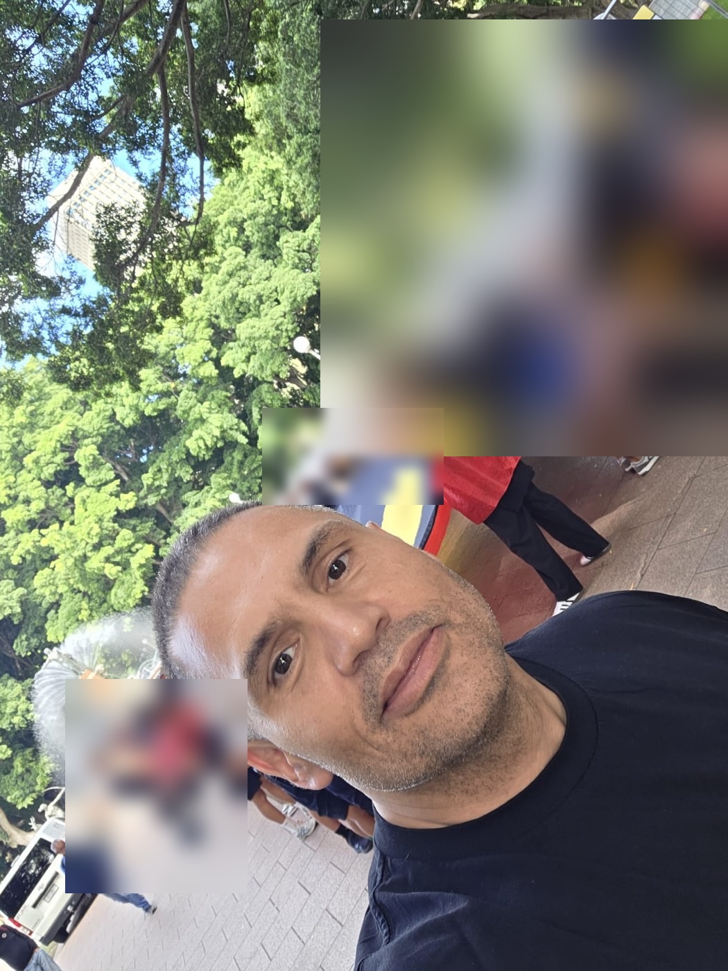 Jamie at a community gathering with the Aboriginal flag